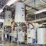 Two CDD-600 Desiccant Dryers with two CDH-2500 Drying Hoppers on stand