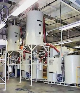 Two CDD-600 Desiccant Dryers with two CDH-2500 Drying Hoppers on stand