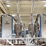 Two HCD-100 Honeycomb Dryers and four CDH-75 Hot Air Dryers mounted on stands